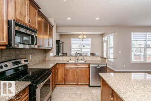 16861 58A Street Nw, Edmonton, AB - Indoor Photo Showing Kitchen With Stainless Steel Kitchen With Double Sink