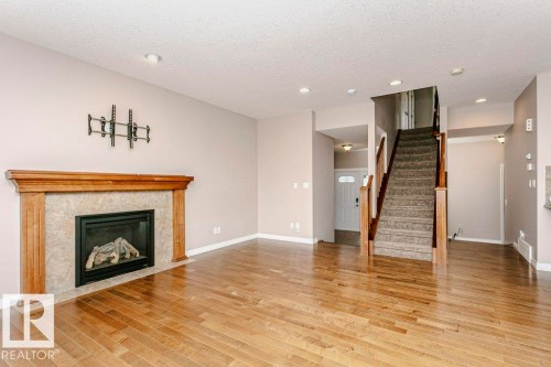 16861 58A Street Nw, Edmonton, AB - Indoor Photo Showing Living Room With Fireplace