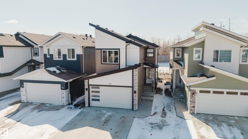The property features a modern exterior design with mixed siding and stone accents - 79 Silverstone Drive, Stony Plain, AB - Outdoor