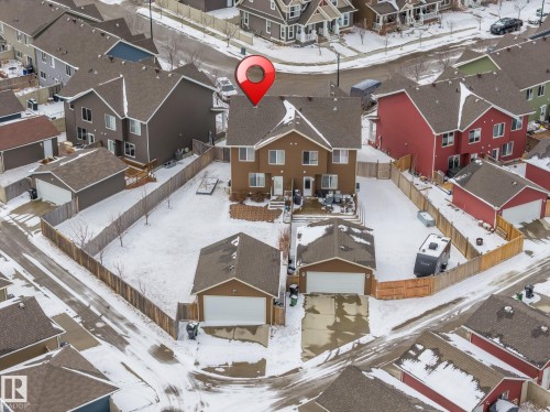 Aerial view of the property, showcasing the main residence, two detached garages, and a fenced yard - 4783 Crabapplle Run, Edmonton, AB - Outdoor