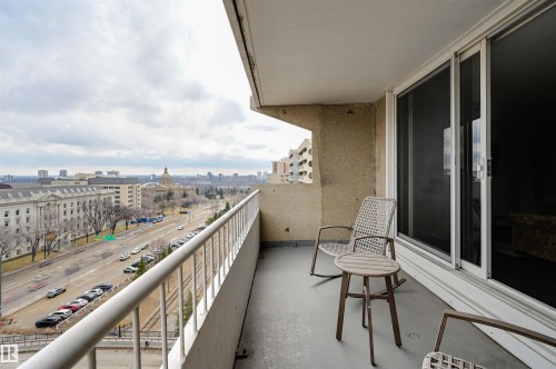 The property features a balcony with a city view, showcasing a domed building and other structures in the distance - 1202 9909 110 Street Nw, Edmonton, AB - Outdoor With Balcony