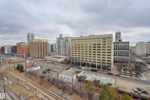 The property features an urban view with a variety of buildings and city infrastructure - 1202 9909 110 Street Nw, Edmonton, AB - Outdoor With View