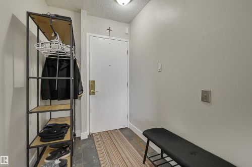 Entryway featuring a white door, light grey walls, and a recessed ceiling light - 1202 9909 110 Street Nw, Edmonton, AB - Indoor Photo Showing Other Room
