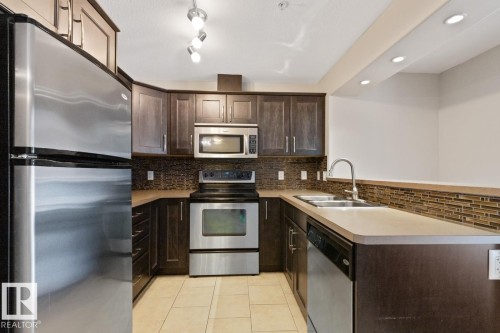 #106 11615 Ellerslie Rd, Edmonton, AB - Indoor Photo Showing Kitchen With Double Sink
