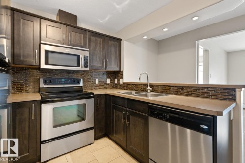 #106 11615 Ellerslie Rd, Edmonton, AB - Indoor Photo Showing Kitchen With Double Sink