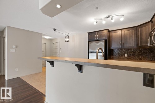 #106 11615 Ellerslie Rd, Edmonton, AB - Indoor Photo Showing Kitchen