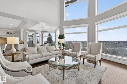 Spacious living area featuring large windows that provide extensive views of the landscape - 1413 Woodward Crescent, Edmonton, AB - Indoor Photo Showing Living Room