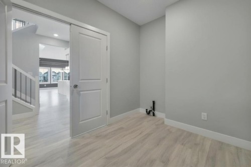 Virtually Staged (wallpaper digitally removed) - 1909 Davidson Wynd, Edmonton, AB - Indoor Photo Showing Other Room