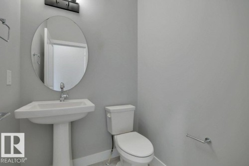 2-piece bathroom on main floor - 1909 Davidson Wynd, Edmonton, AB - Indoor Photo Showing Bathroom