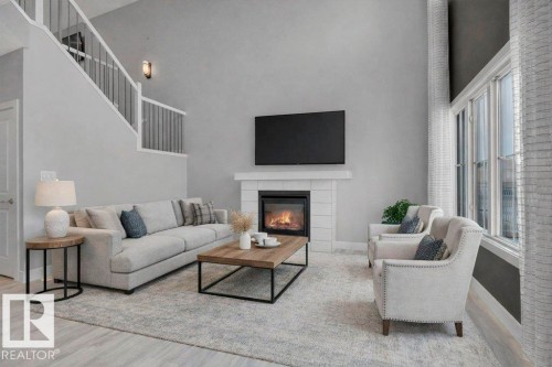 With Open-to-Below. Virtually Staged. - 1909 Davidson Wynd, Edmonton, AB - Indoor Photo Showing Living Room With Fireplace