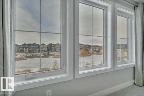 Overlooking pond. - 1909 Davidson Wynd, Edmonton, AB - Indoor Photo Showing Other Room