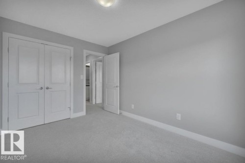 Virtually Staged (wallpaper digitally removed) - 1909 Davidson Wynd, Edmonton, AB - Indoor Photo Showing Other Room