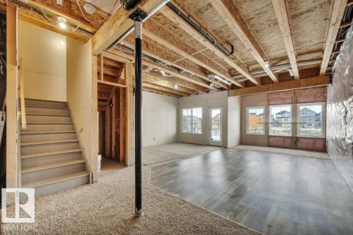 Walk-out basement with large windows - 1909 Davidson Wynd, Edmonton, AB - Indoor Photo Showing Other Room