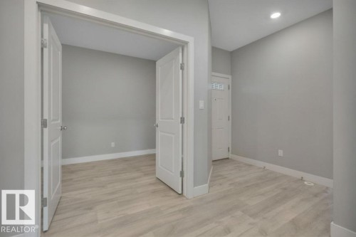 Virtually Staged (wallpaper digitally removed) - 1909 Davidson Wynd, Edmonton, AB - Indoor Photo Showing Other Room