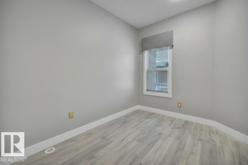 Virtually Staged (wallpaper digitally removed) - 1909 Davidson Wynd, Edmonton, AB - Indoor Photo Showing Other Room