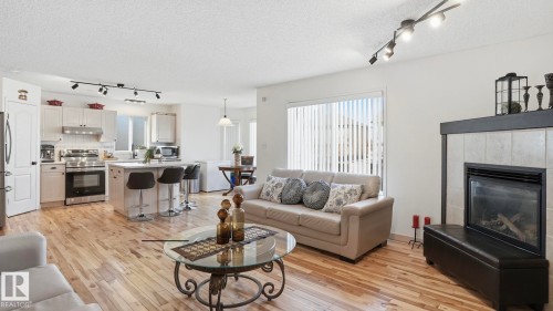 1310 Barnes Close, Edmonton, AB - Indoor Photo Showing Living Room With Fireplace