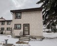 The property features a stucco exterior, brown trim around the windows and door, and a brown roof - 36 17409 95 Street, Edmonton, AB  - Outdoor 