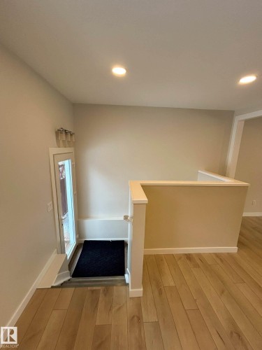 Entryway featuring light-colored walls, recessed ceiling lighting, and light wood flooring - 56 Salisbury Avenue, St. Albert, AB - Indoor Photo Showing Other Room