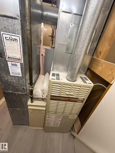 Utility area featuring a furnace and water heater installation - 56 Salisbury Avenue, St. Albert, AB - Indoor Photo Showing Basement