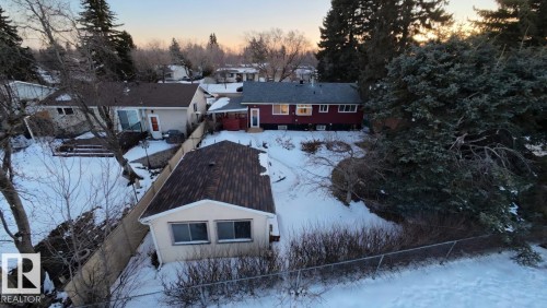 The property features a red exterior with a dark roof and multiple windows - 56 Salisbury Avenue, St. Albert, AB - Outdoor