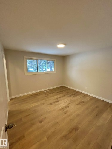 Room featuring hardwood flooring and a window providing natural light - 56 Salisbury Avenue, St. Albert, AB - Indoor Photo Showing Other Room