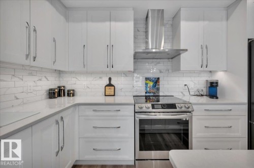 AN ABUNDANCE OF CABINETS AND POT DRAWERS - 404 7463 May Common Nw, Edmonton, AB - Indoor Photo Showing Kitchen With Upgraded Kitchen
