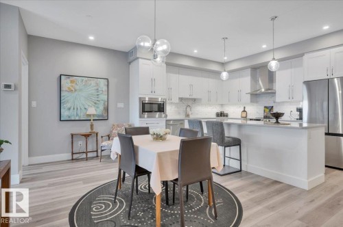 LARGE SPACE TO ACCOMMODATE A GENEROUS DINING TABLE - 404 7463 May Common Nw, Edmonton, AB - Indoor