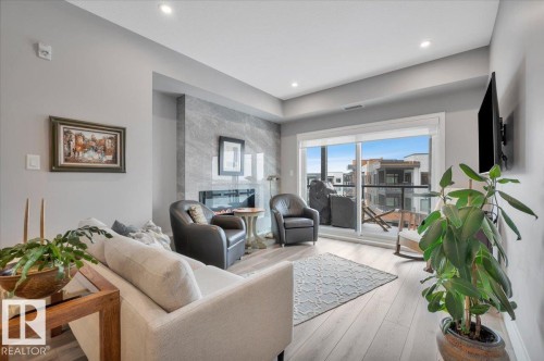 404 7463 May Common Nw, Edmonton, AB - Indoor Photo Showing Living Room