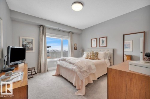 STUNNING RAVINE AND DOWNTOWN VIEWS FROM THE BEDROOM WINDOW - 404 7463 May Common Nw, Edmonton, AB - Indoor Photo Showing Bedroom