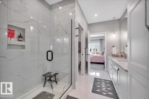 LARGE WALK IN SHOWER WITH GLASS DOORS - 404 7463 May Common Nw, Edmonton, AB - Indoor Photo Showing Bathroom