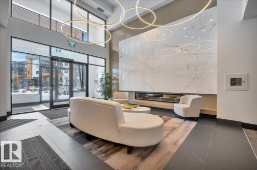 BUILDING ENTRANCE - 404 7463 May Common Nw, Edmonton, AB - Indoor Photo Showing Other Room