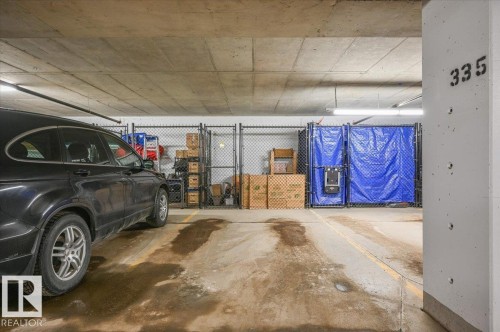 HEATED UNDERGROUND STALL WITH STORAGE CAGE - 404 7463 May Common Nw, Edmonton, AB - Indoor Photo Showing Garage