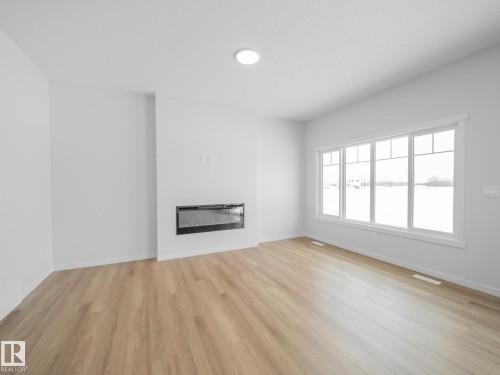 927 18 Avenue, Edmonton, AB - Indoor Photo Showing Living Room With Fireplace