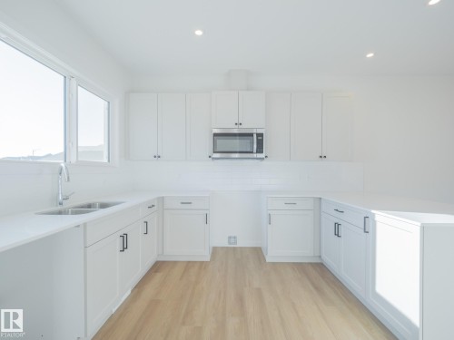 17218 4 Street, Edmonton, AB - Indoor Photo Showing Kitchen With Double Sink