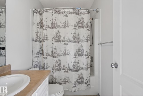 Bathroom featuring a vanity with an integrated sink and a shower with a tub - 421 84 Street, Edmonton, AB - Indoor Photo Showing Bathroom