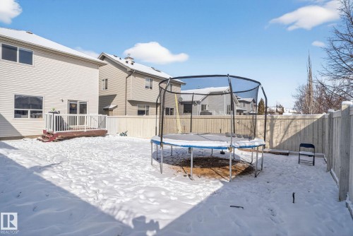 The property features a fenced yard with a deck, providing a private outdoor space - 421 84 Street, Edmonton, AB - Outdoor With Deck Patio Veranda