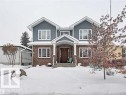 The property features a brick and siding exterior with a welcoming covered front entry - 10836 130 Street, Edmonton, AB  - Outdoor 