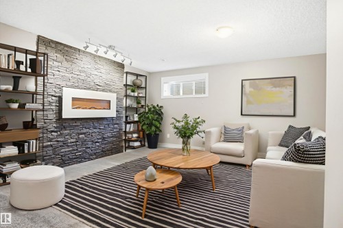 6861 Cardinal Link, Edmonton, AB - Indoor Photo Showing Living Room With Fireplace