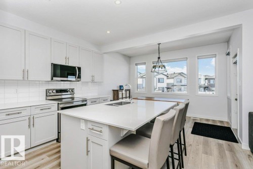 18 Elderberry Point(E), Fort Saskatchewan, AB - Indoor Photo Showing Kitchen With Double Sink With Upgraded Kitchen