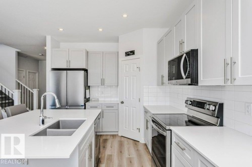 18 Elderberry Point(E), Fort Saskatchewan, AB - Indoor Photo Showing Kitchen With Double Sink With Upgraded Kitchen