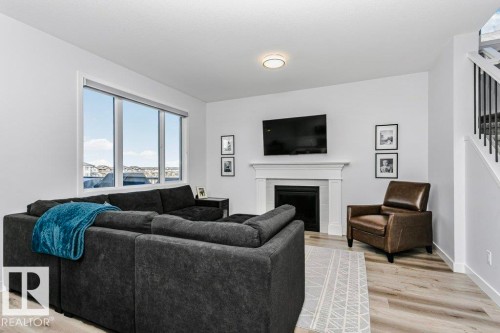 18 Elderberry Point(E), Fort Saskatchewan, AB - Indoor Photo Showing Living Room With Fireplace