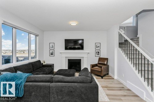 18 Elderberry Point(E), Fort Saskatchewan, AB - Indoor Photo Showing Living Room With Fireplace