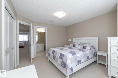 This room features light-colored walls and carpeted flooring, creating a bright and inviting atmosphere - 132 Kirpatrick Way, Leduc, AB - Indoor Photo Showing Bedroom