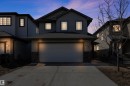 The property features a two-story exterior with dark siding and a prominent garage - 316 Avena Link, Leduc, AB  - Outdoor 