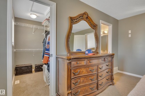 The property includes a walk-in closet with wire shelving and recessed lighting - 316 Avena Link, Leduc, AB - Indoor