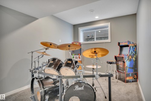 The room features light gray walls, a window with a white frame, and recessed lighting - 316 Avena Link, Leduc, AB - Indoor
