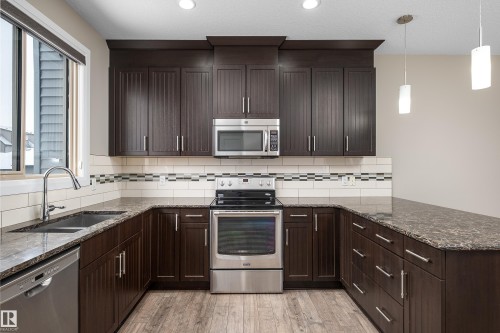 76 Gilmore Way, Spruce Grove, AB - Indoor Photo Showing Kitchen With Double Sink With Upgraded Kitchen