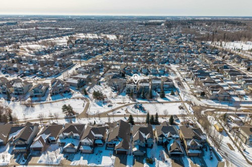 Aerial view of the neighborhood featuring residential properties with varying rooflines and a well-maintained street grid - 20714 56A Avenue, Edmonton, AB - Outdoor With View