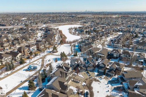 Aerial view of the neighborhood showcasing the property's proximity to a public park with a playground and a body of water - 20714 56A Avenue, Edmonton, AB - Outdoor With View