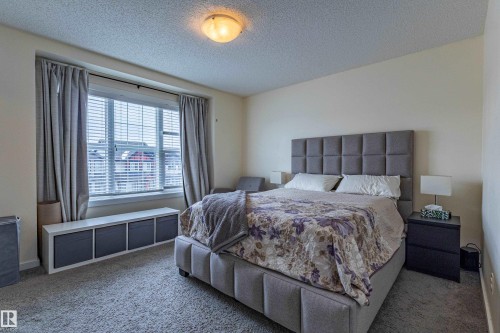 This room features neutral-toned carpeting and light-colored walls - 2679 Maple Way, Edmonton, AB - Indoor Photo Showing Bedroom